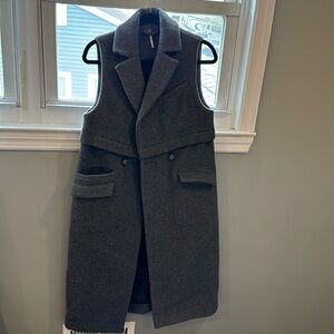 Free people long Vest.  55%-wool 35%- Polyester 10%-Polyamide